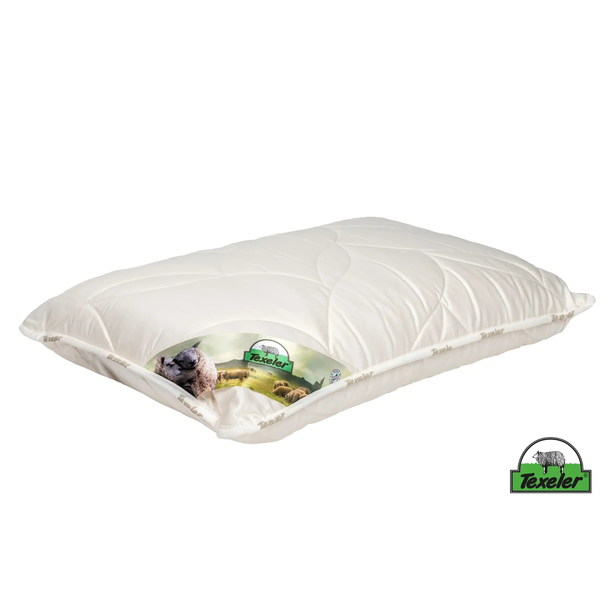 A white Texeler Soezz Supple wool Pillow with a latex core and wool filling. Laying flat on a white surface
